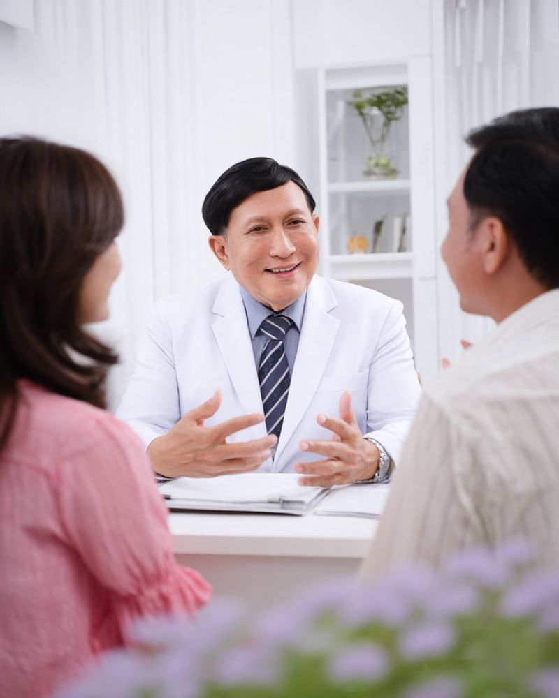 Illustrative image: Dr. Tongtis talking with a couple